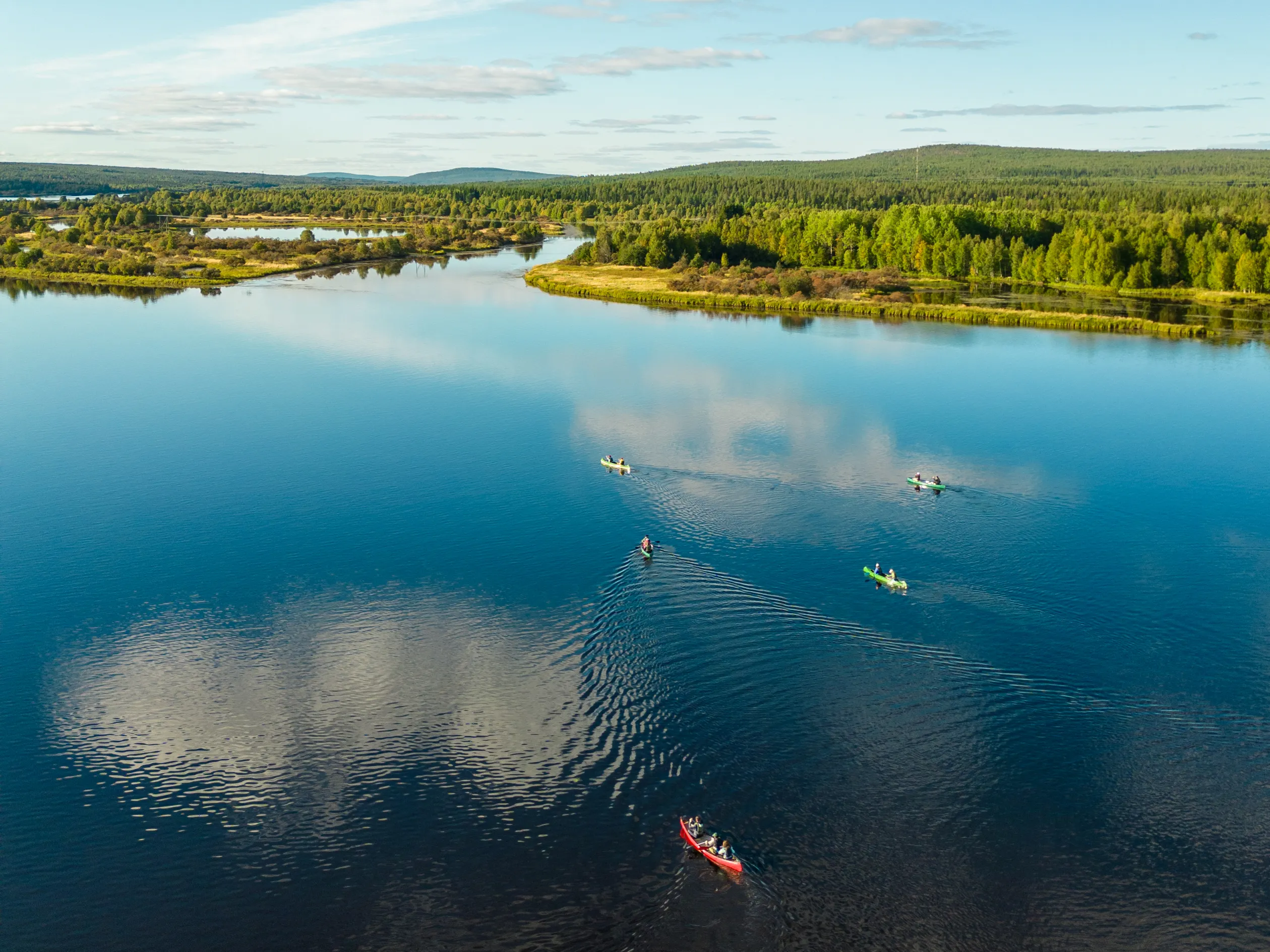 Aerial view of canoes on a wide river in summer